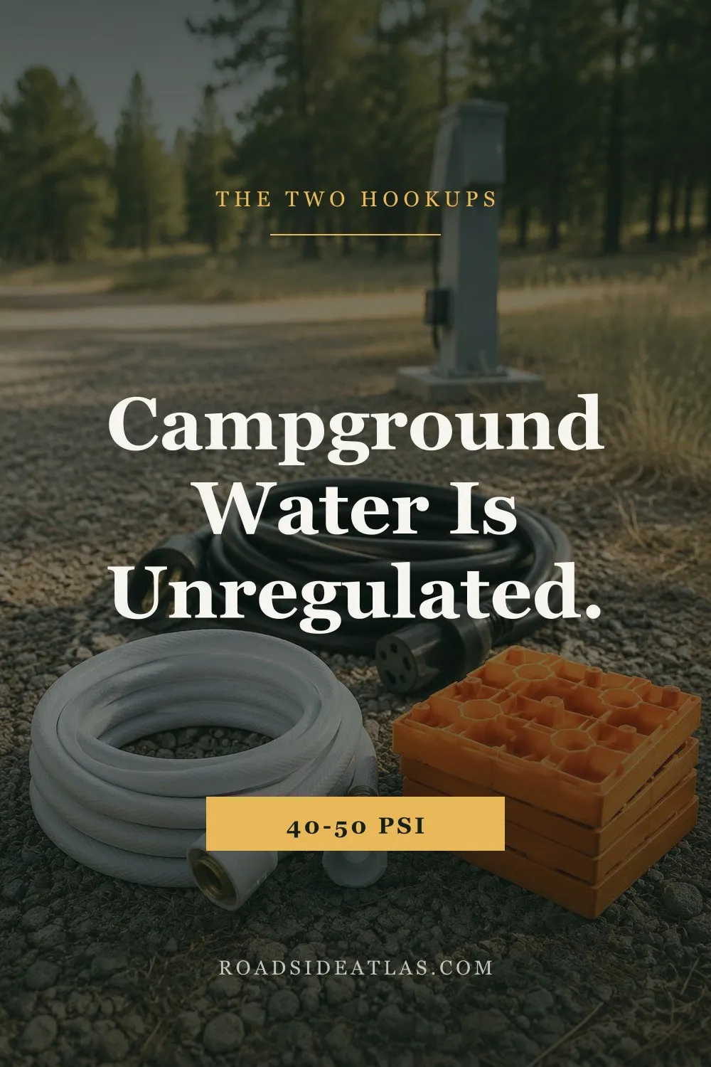 A campsite water spigot on a gravel pad with a coiled white drinking-water hose and stacked orange leveling blocks beside it